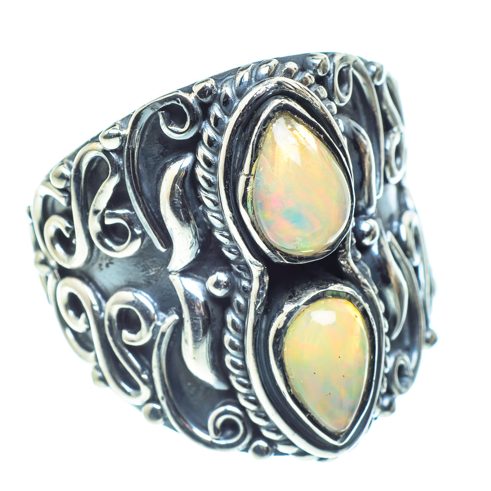 Sterling silver opal ring with two oval opal stones and swirling engraved band