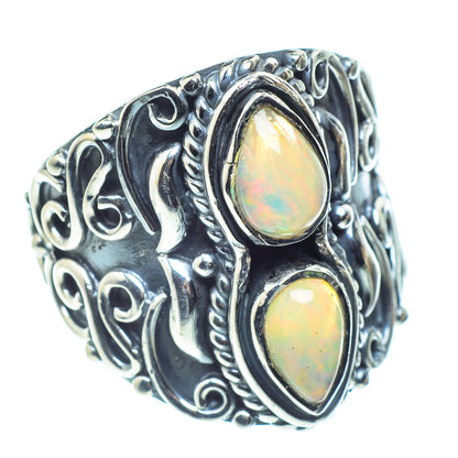 Sterling silver opal ring with two oval opal stones and swirling engraved band