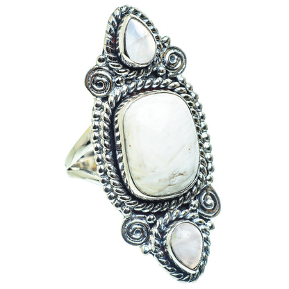 Silver-tone oval gemstone ring with textured scroll side settings and center white stone