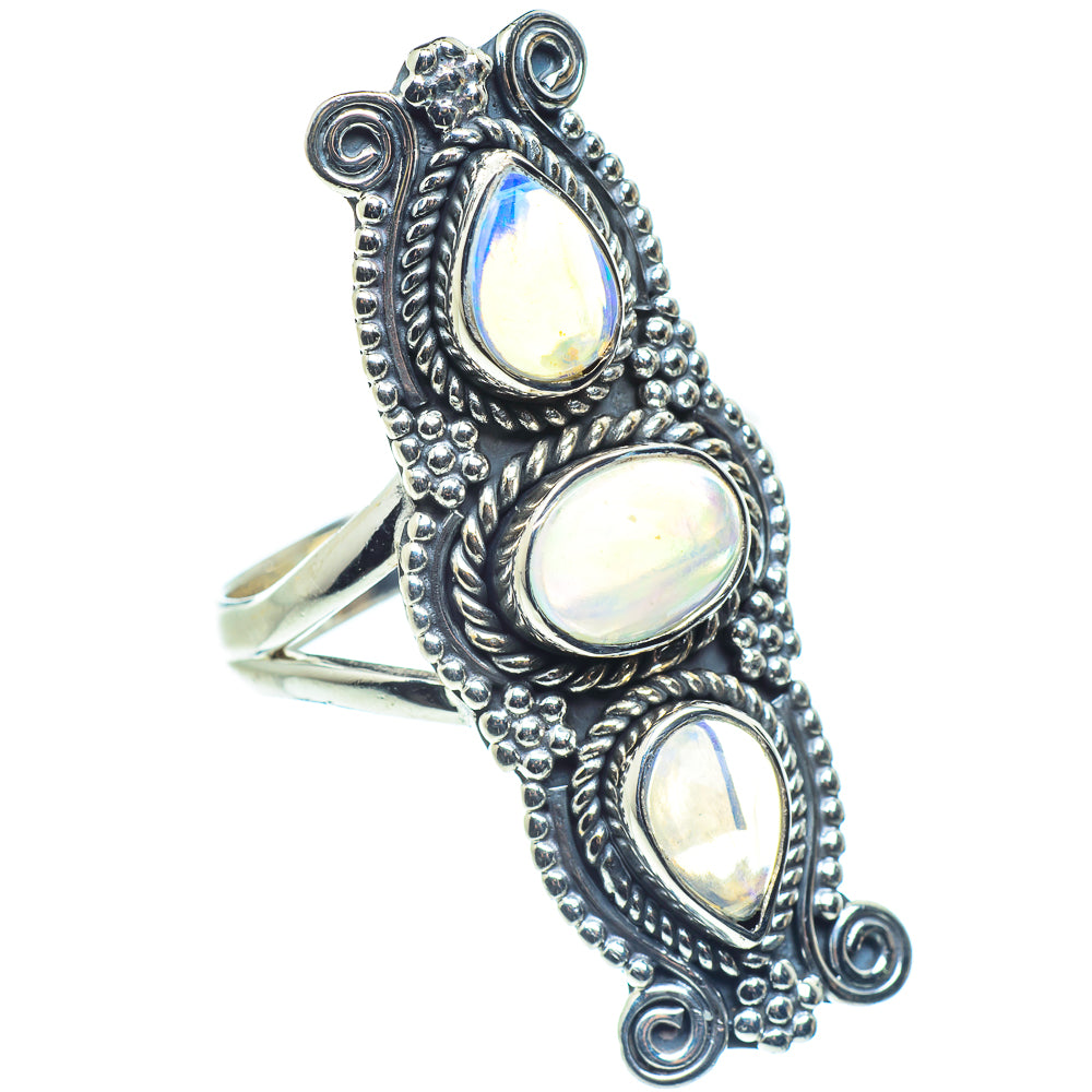 Sterling silver opal ring with three oval opalescent gemstones, ornate scroll setting