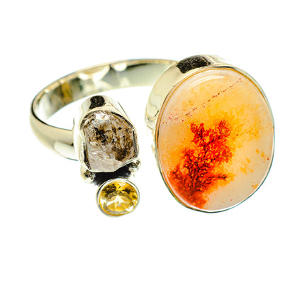 Adjustable sterling silver ring with large oval orange dendritic centerpiece and yellow accent stone