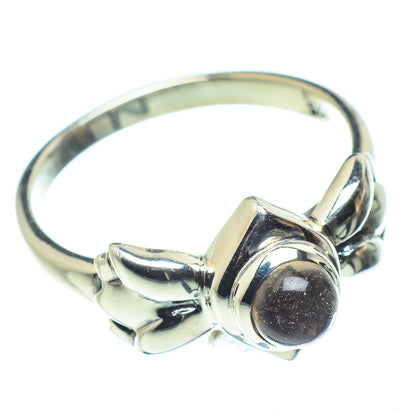 Sterling silver smoky quartz ring, side view of dark round cabochon setting