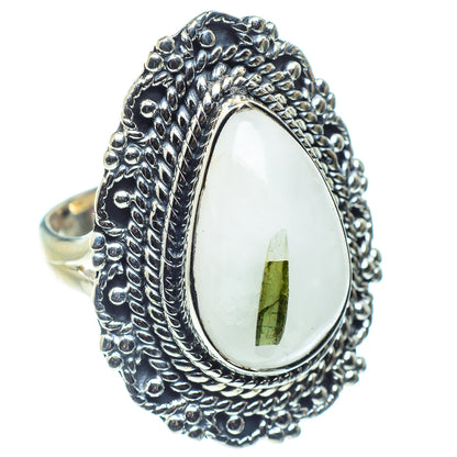 Sterling silver statement ring with oval white stone and green tourmaline inclusion