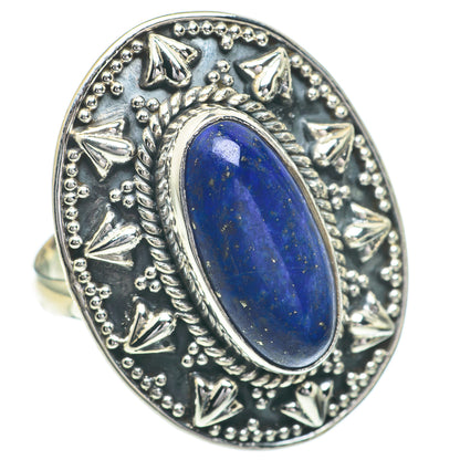 Lapis lazuli oval ring in silver-toned setting with ornate raised borders