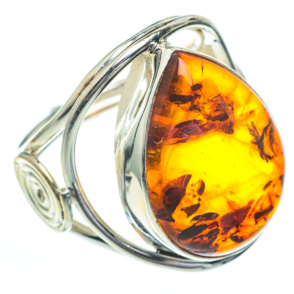 Sterling silver amber ring with teardrop cabochon and spiral accent, side view