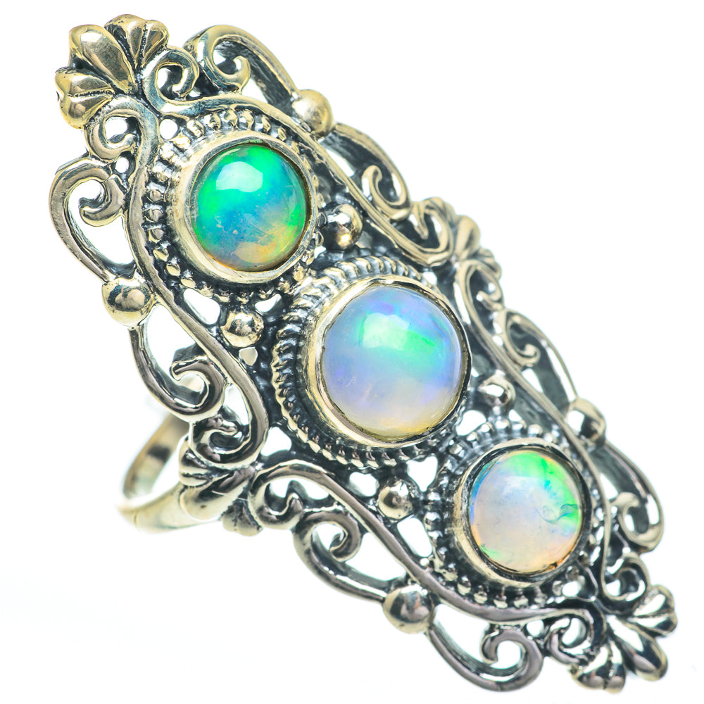 Antique-style silver ring with three oval iridescent opal stones and decorative scrollwork