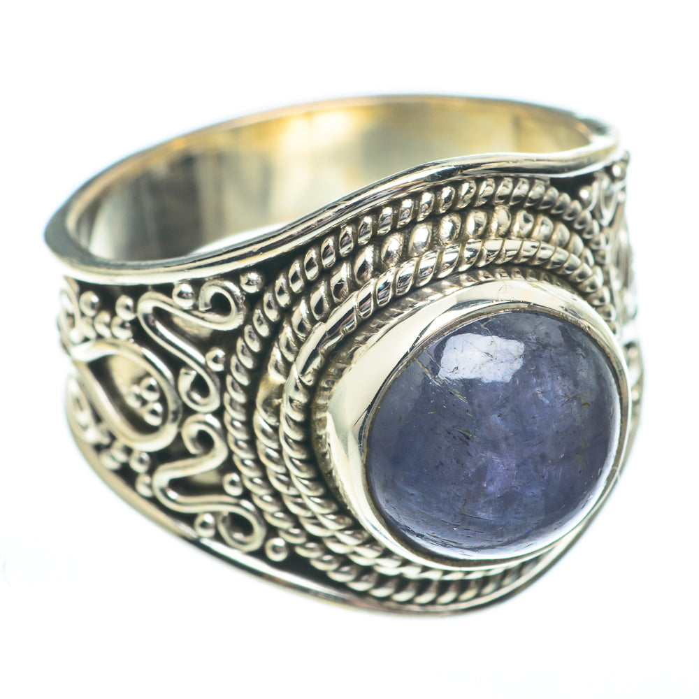 Oval dark blue tanzanite gemstone set in ornate sterling silver ring, size 6.25