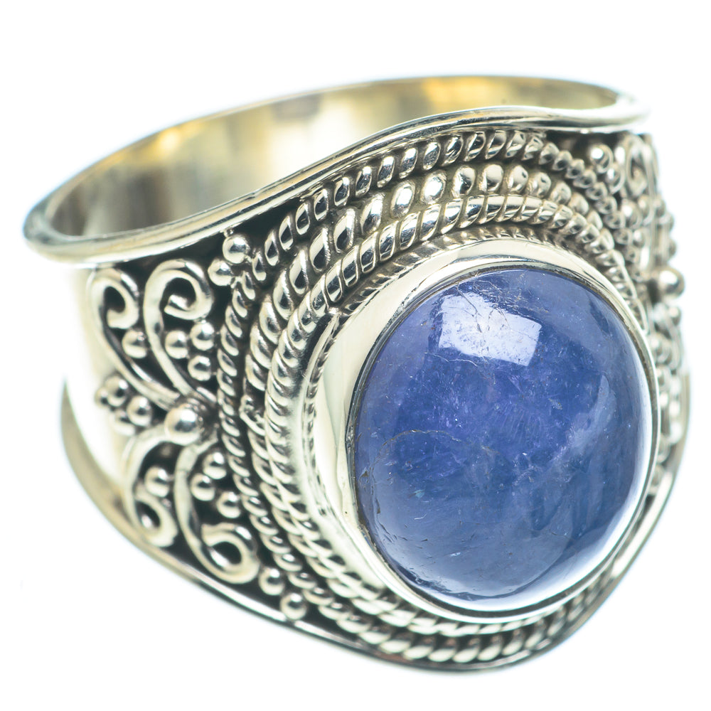 Sterling silver ring with oval blue gemstone and ornate filigree bezel
