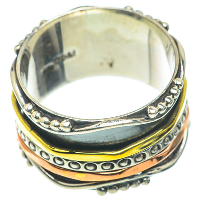 Meditation spinner ring, silver outer band with bead and engraved circle details; yellow/black
