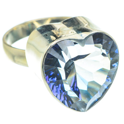 Sterling silver heart ring with blue faceted gemstone in polished bezel setting