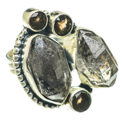 Sterling silver ring with smoky quartz oval, bezel-set faceted stones and dark side accents