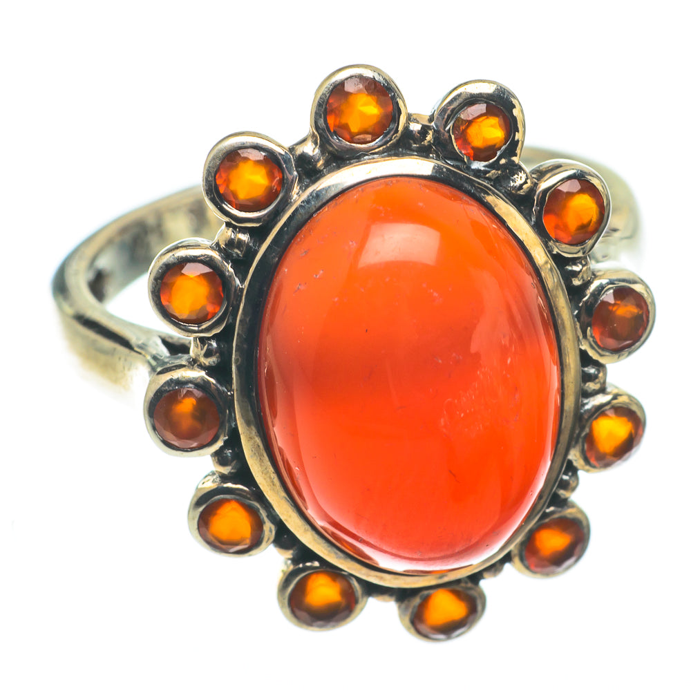 Oval orange carnelian cabochon ring in sterling silver with halo of small amber stones