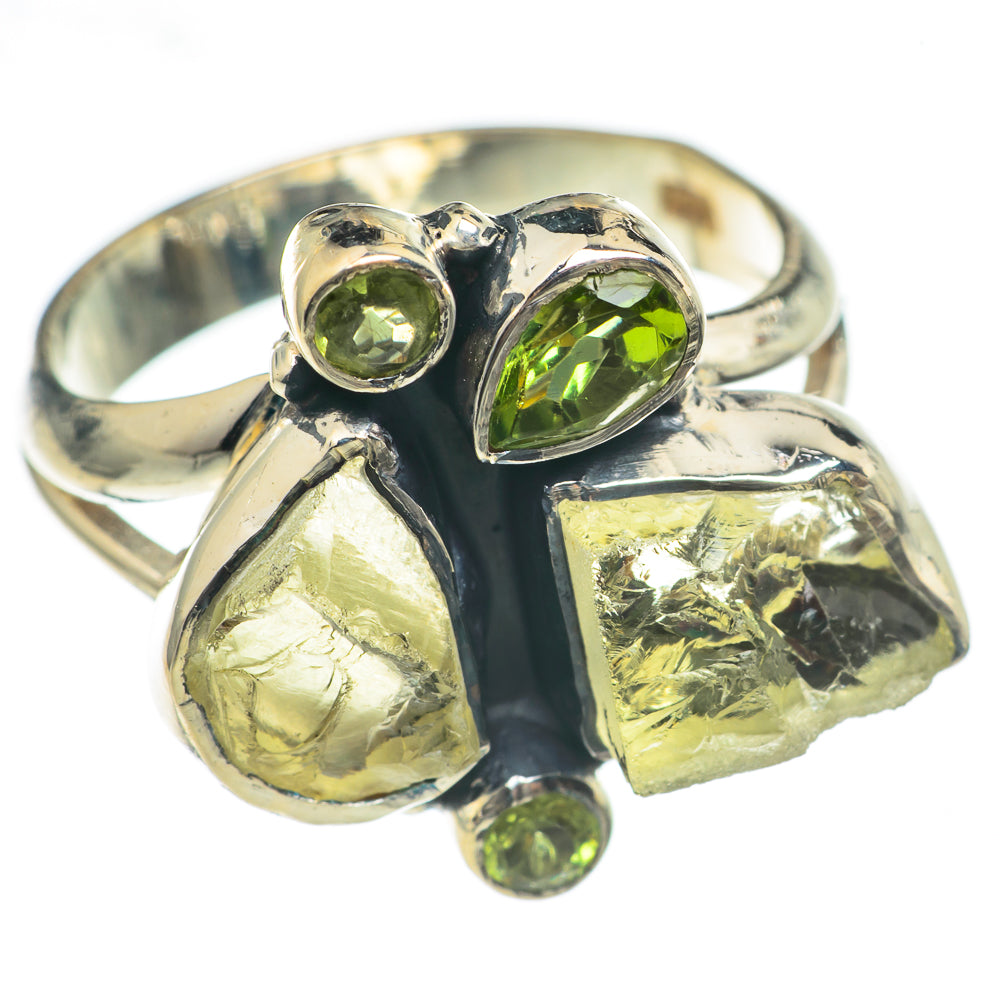925 sterling silver peridot ring with four green stones and rough yellow-green crystal pieces.