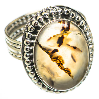 Sterling silver oval agate ring with amber-gold cabochon and dark inclusions, prong bezel