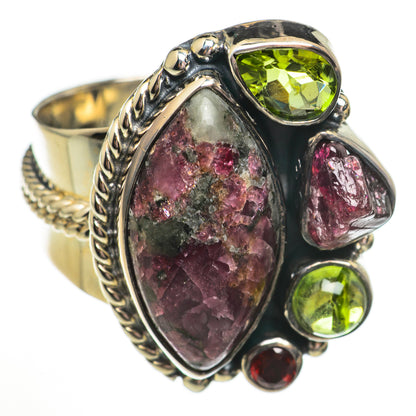 Sterling silver gemstone ring with large oval purple-red stone and green red accents