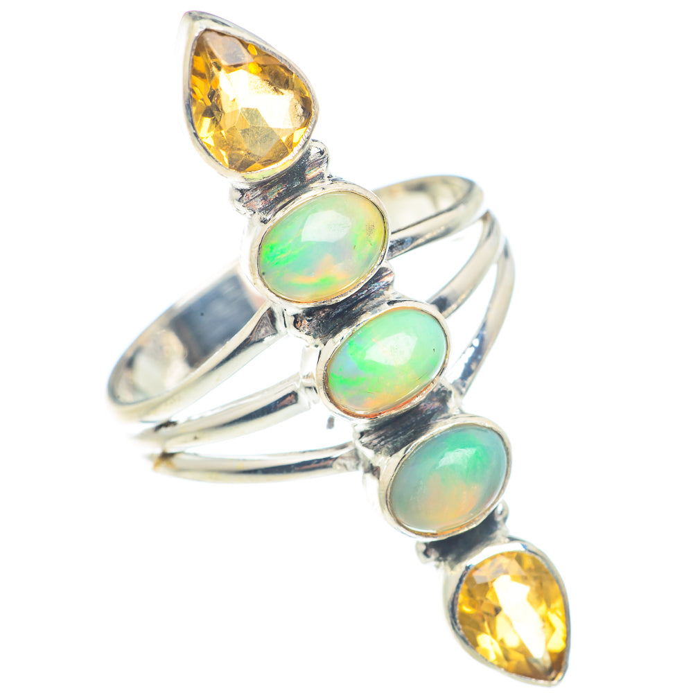 Sterling silver ring with three opal-like oval stones and two yellow gemstones