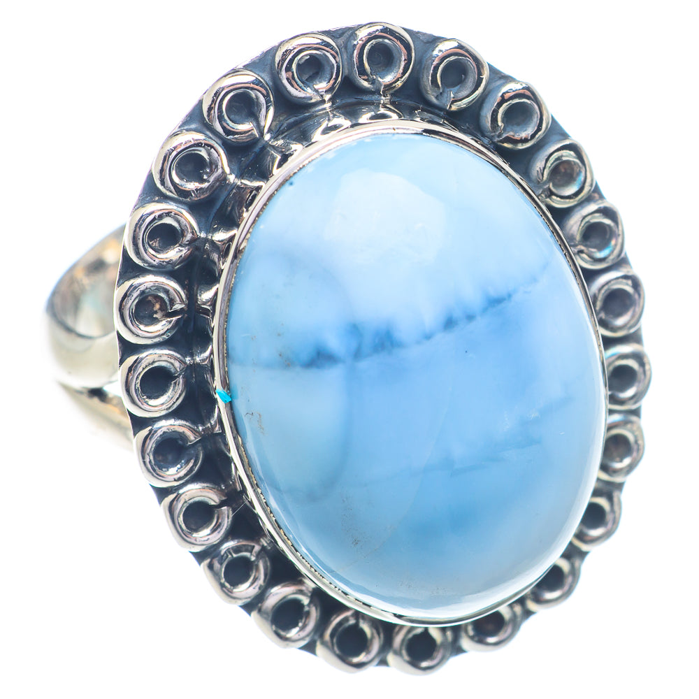 Sterling silver opal ring with oval light blue cabochon and raised bead borders
