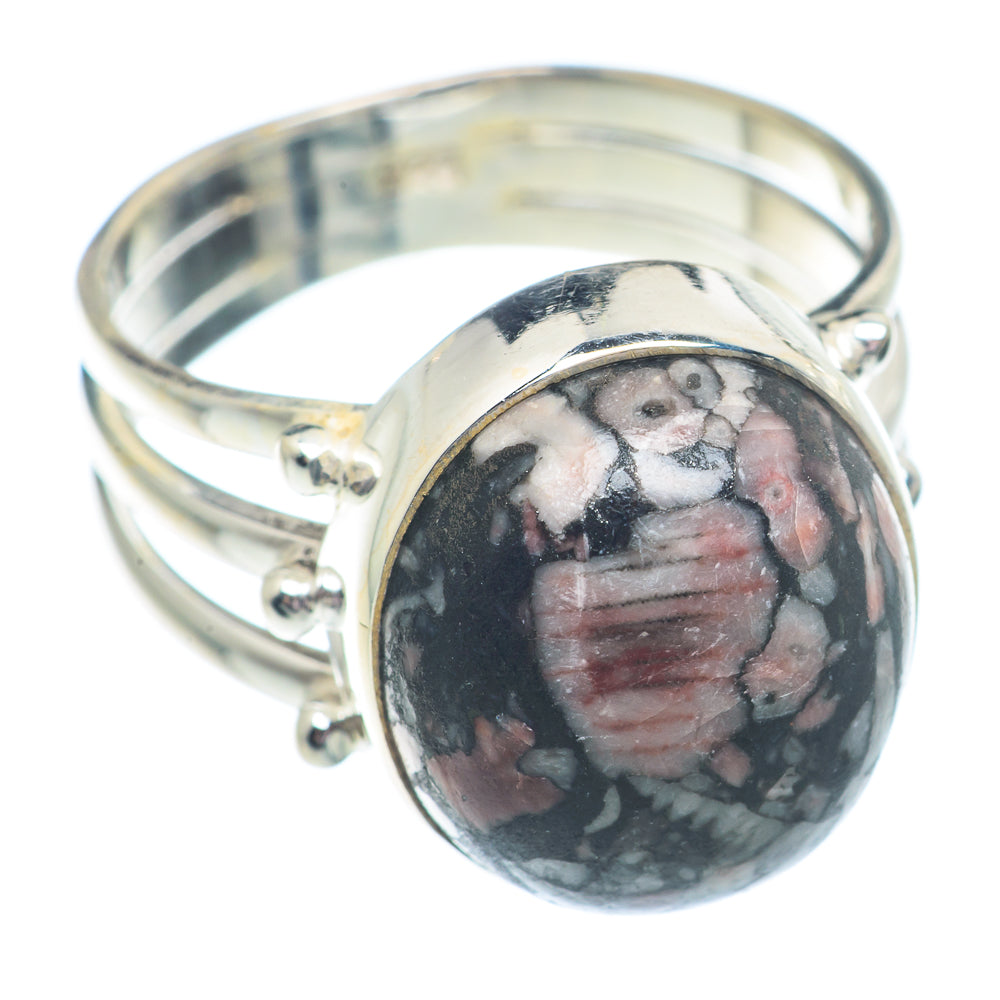 Sterling silver oval fossil ring with dark cabochon and ridged bezel