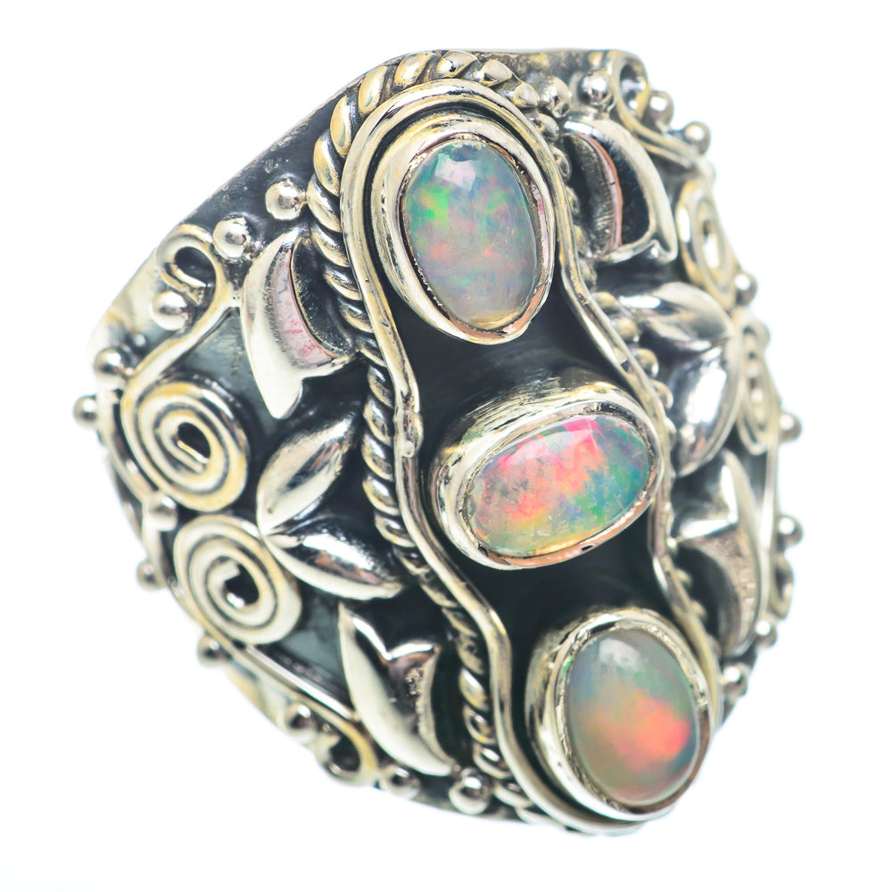 Sterling silver opal ring with three oval opal cabochons and ornate scroll design