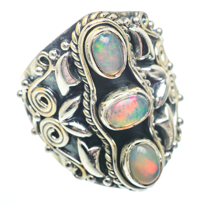 Sterling silver opal ring with three oval opal cabochons and ornate scroll design