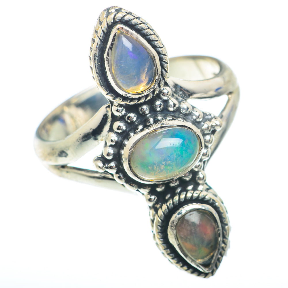 Sterling silver opal ring with three oval bezel-set opal stones