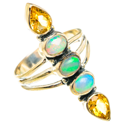 Sterling silver ring showing stacked opal cabochons with two yellow citrine accents