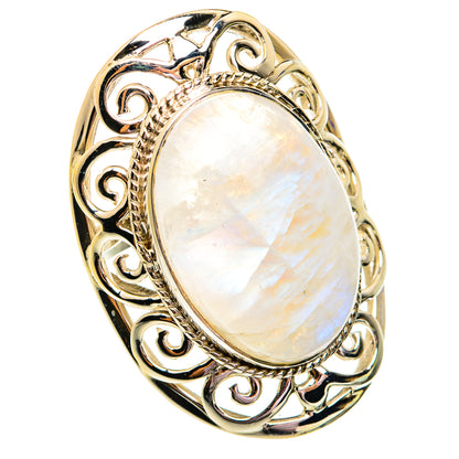 Moonstone oval ring in polished gold-tone setting with ornate scrollwork and white glow