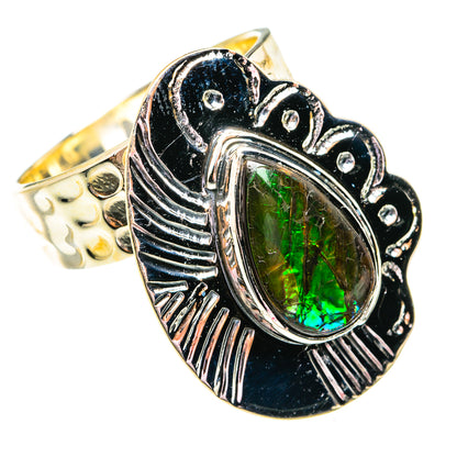 Sterling silver ammolite ring with oval green iridescent stone, dark bezel side angle