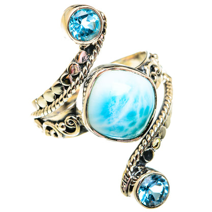Sterling silver ring with oval blue larimar center, braided borders, and round blue topaz
