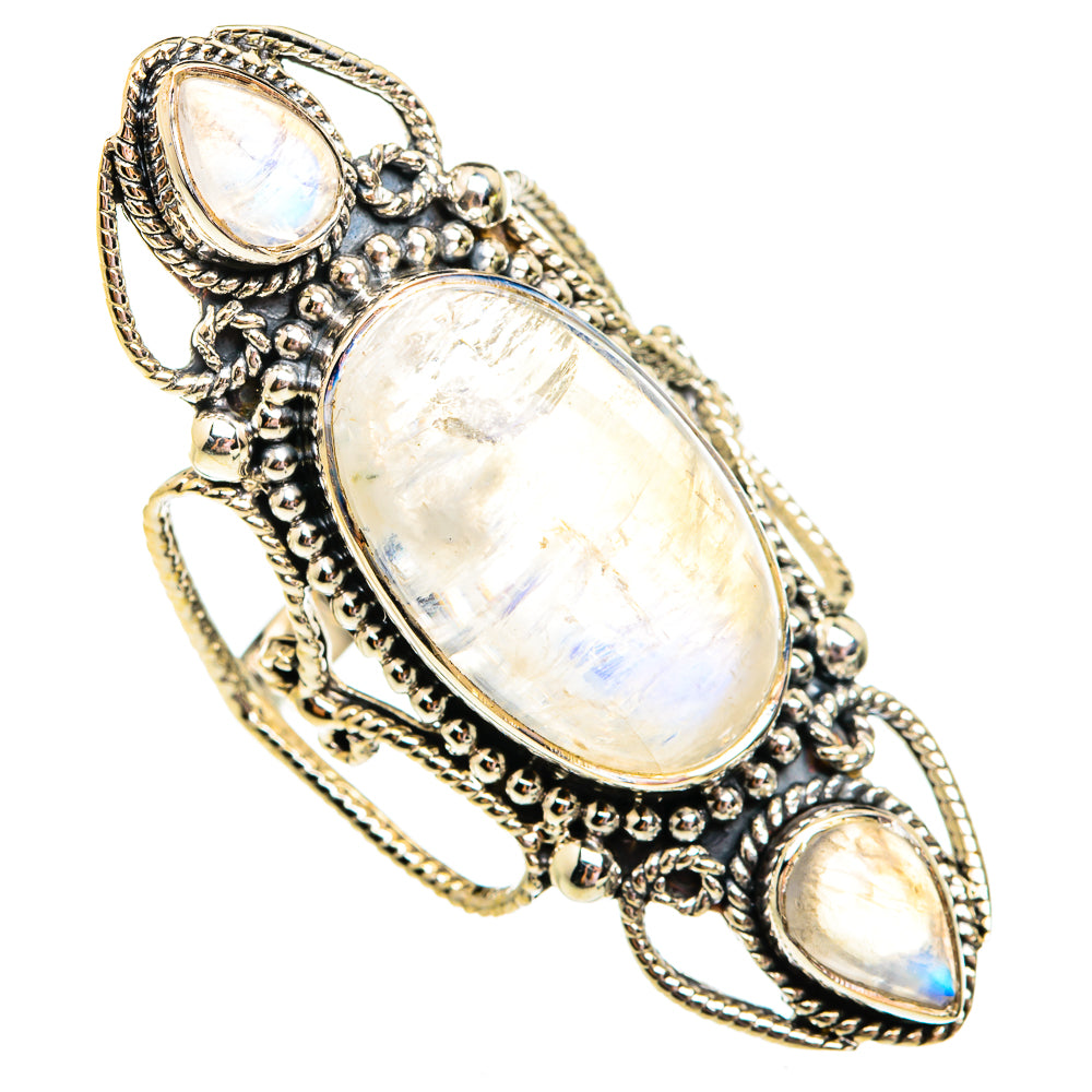 Silver-toned statement ring with oval moonstone centerpiece and three opal-like stones
