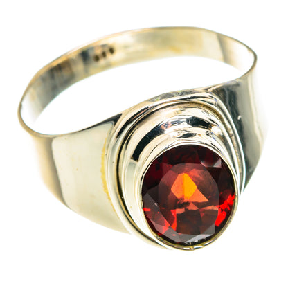 Silver ring with round red garnet center stone and polished bezel swirl