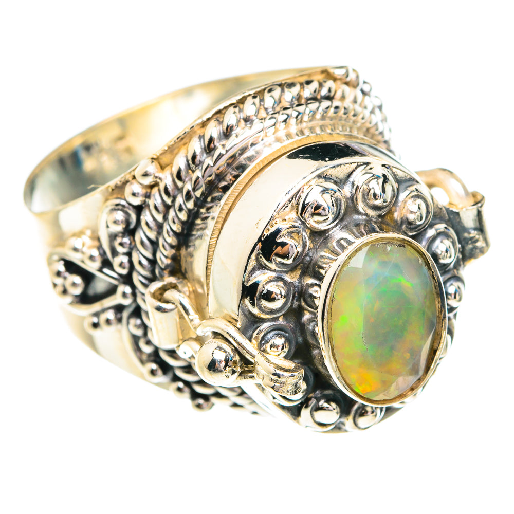 Sterling silver ring with oval opal and ornate filigree bezel