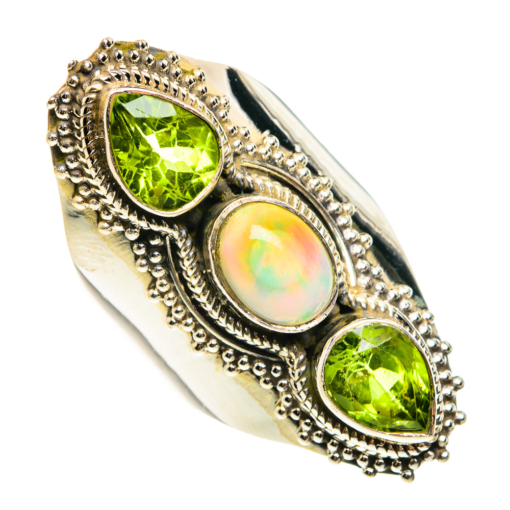 Sterling silver statement ring with scalloped borders and three oval stones, peridot and opal