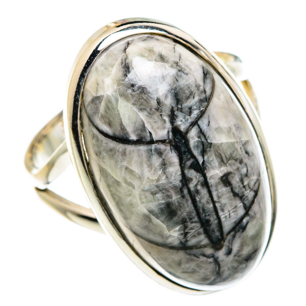 Sterling silver oval fossil ring with gray stone and dark veining, shiny bezel.