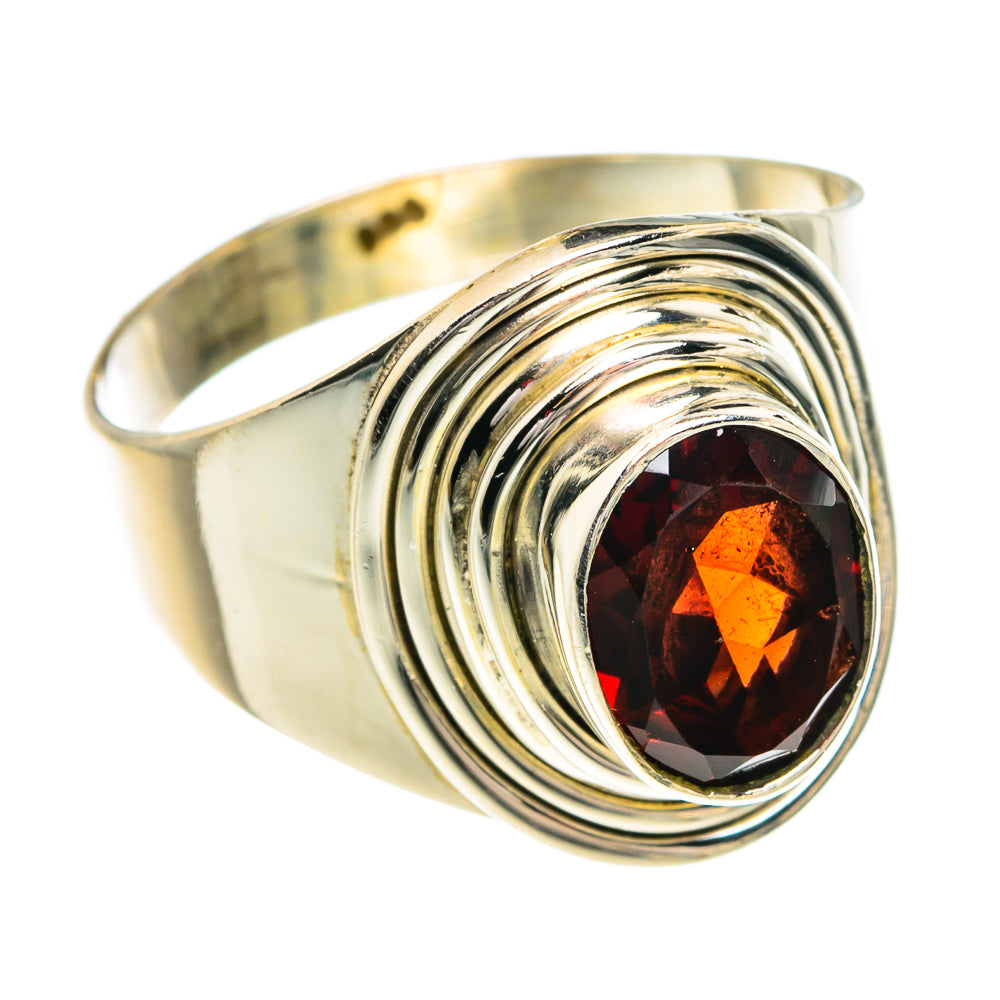 Sterling silver ring with oval garnet gemstone and layered swirl bezel