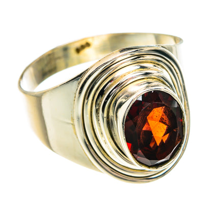 Sterling silver ring with oval garnet gemstone and layered swirl bezel