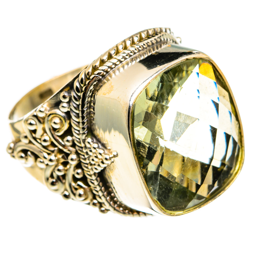 Sterling silver oval ring with large faceted green gemstone and detailed braided setting