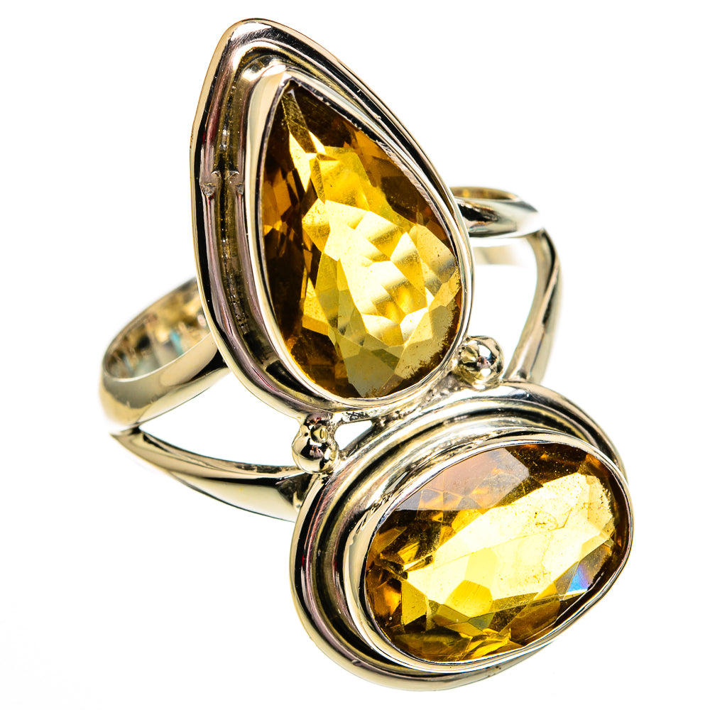 Sterling silver ring featuring two faceted oval citrine gemstones in scalloped settings