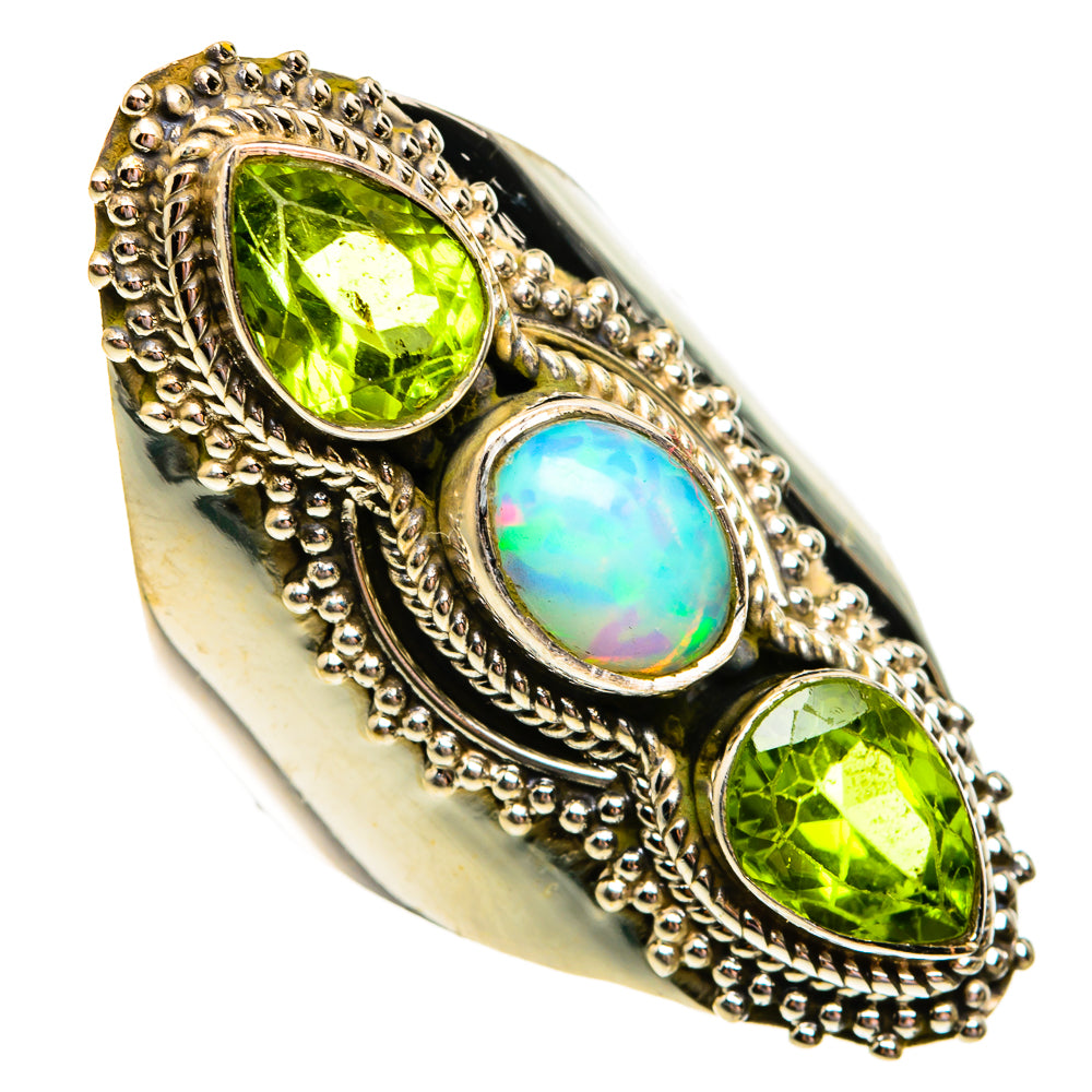 Sterling silver ring featuring oval green peridot stones and central opal, raised ornate setting