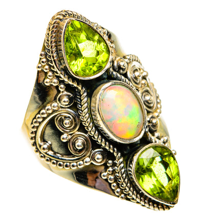 Silver statement ring with large green peridot oval stones and oval opal cabochon