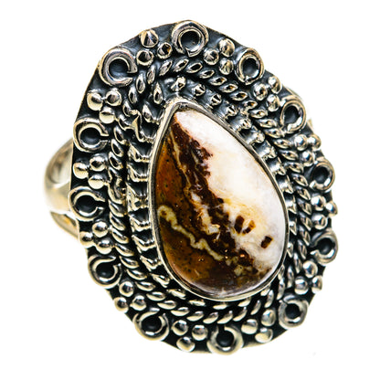 Sterling silver oval jasper ring with raised bezel and beaded textured band