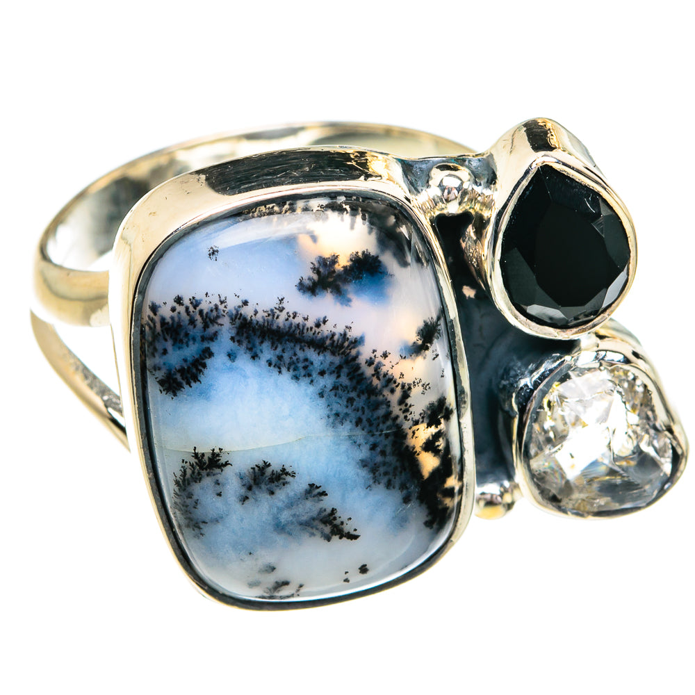 Dendritic opal ring with large oval cabochon, dark onyx bezel, and clear round diamond