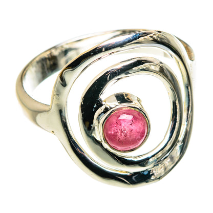 Pink tourmaline sterling silver ring with round bezel-set stone and swirling openwork band