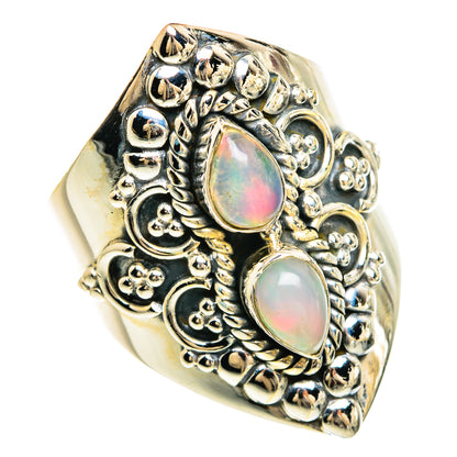 Sterling silver filigree ring with two oval opal cabochons, iridescent pink-green