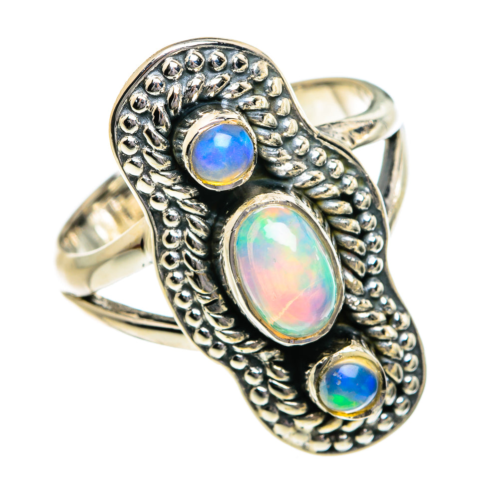 Sterling silver opal ring with oval blue-green center and two small round stones