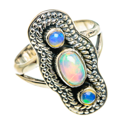 Sterling silver opal ring with oval blue-green center and two small round stones