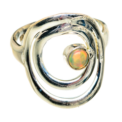 Silver opal ring with round Ethiopian opal in swirling openwork setting