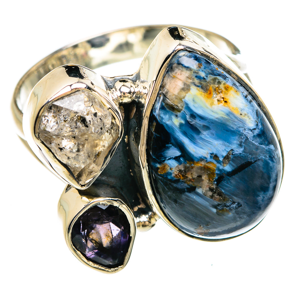 Sterling silver ring with oval blue stone, two dark and rough crystal accents