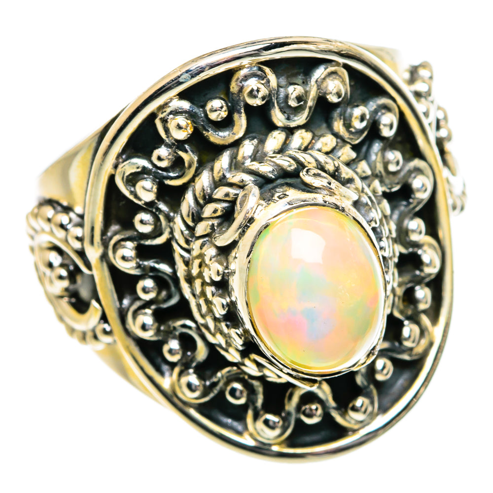 Oval opal ring in 925 sterling silver with ornate filigree and bezel setting