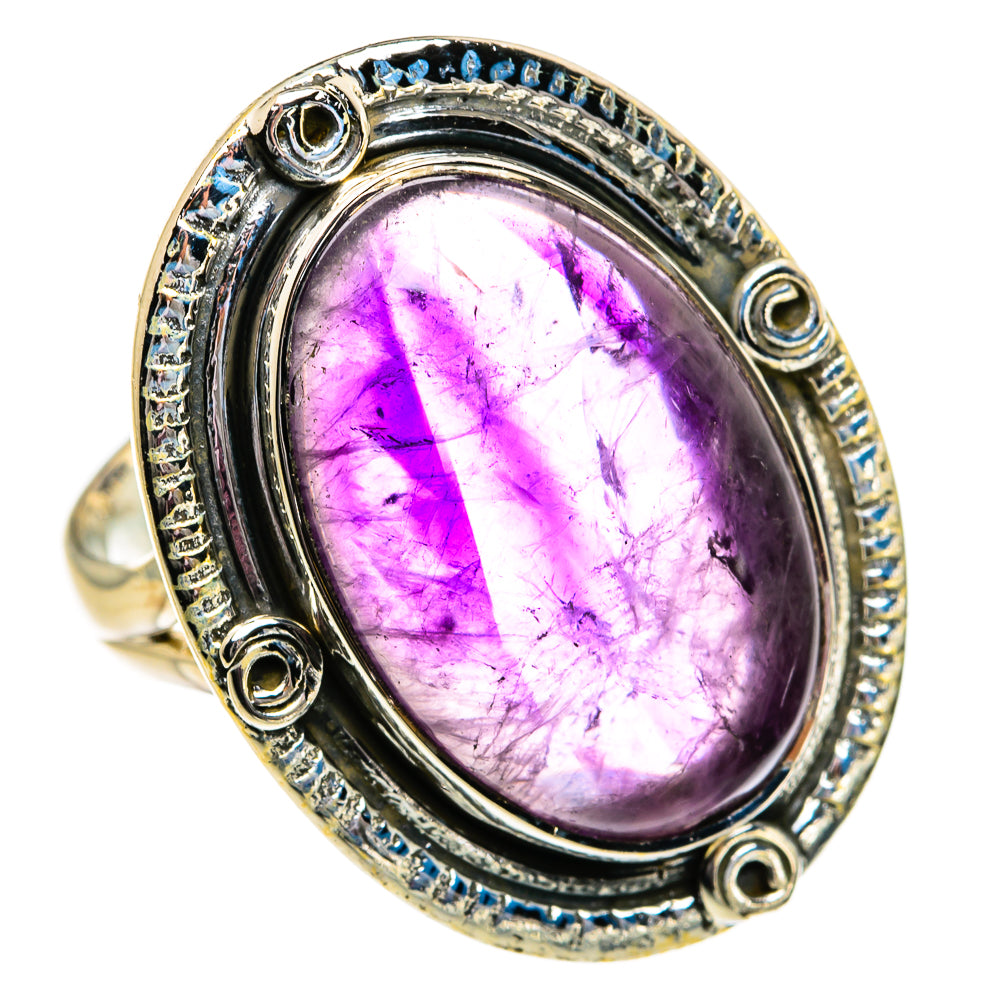 Oval amethyst gemstone silver ring with ornate bezel and side scroll accents